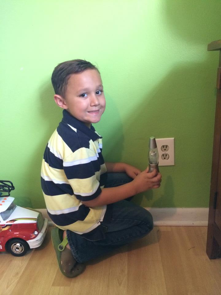 Boy Unplugging Nightlight 