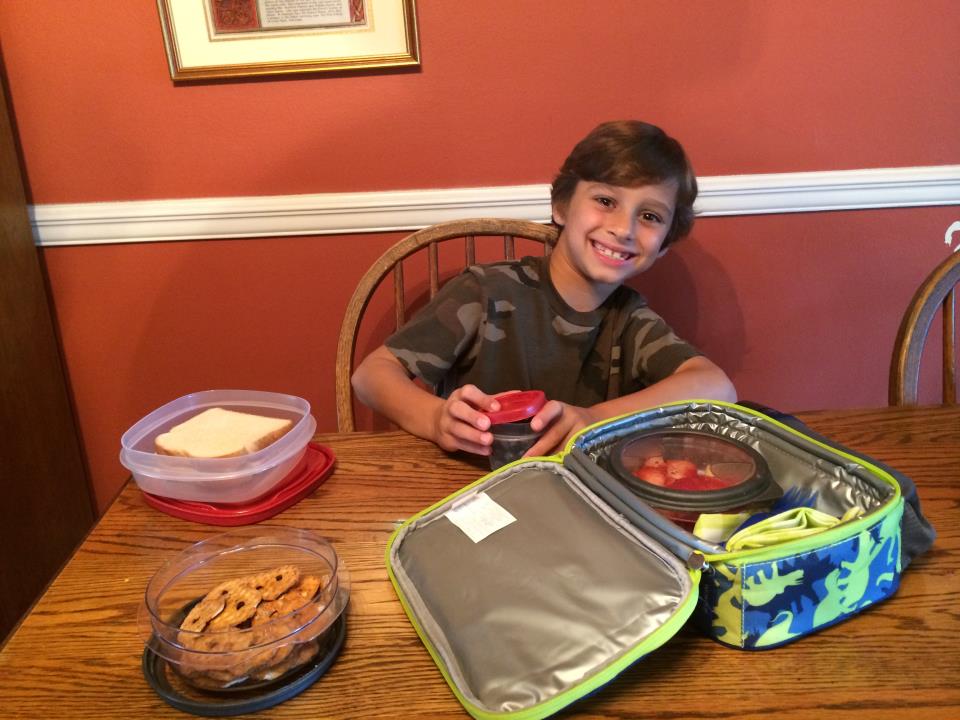 Boy packing zero waste lunch