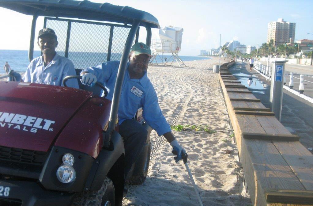 Crews picking litter on beach